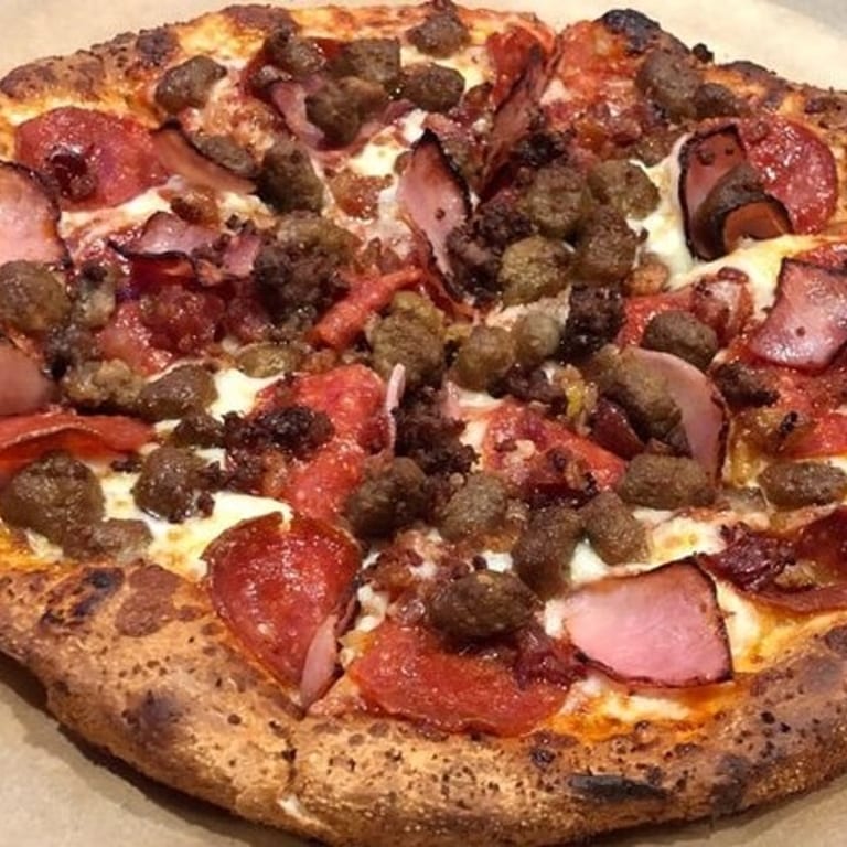 Indulge in Our Meat Lovers Pizza