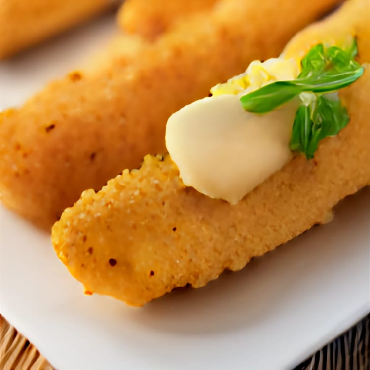 Bread sticks mozzarella cheese on top.